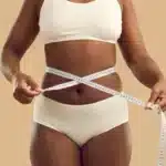 Overweight black girl make measurement before diet Overweight black girl make measurement before diet